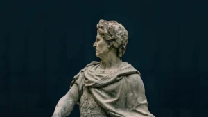 Close-up of a marble statue depicting a classical historical figure with intricate details.